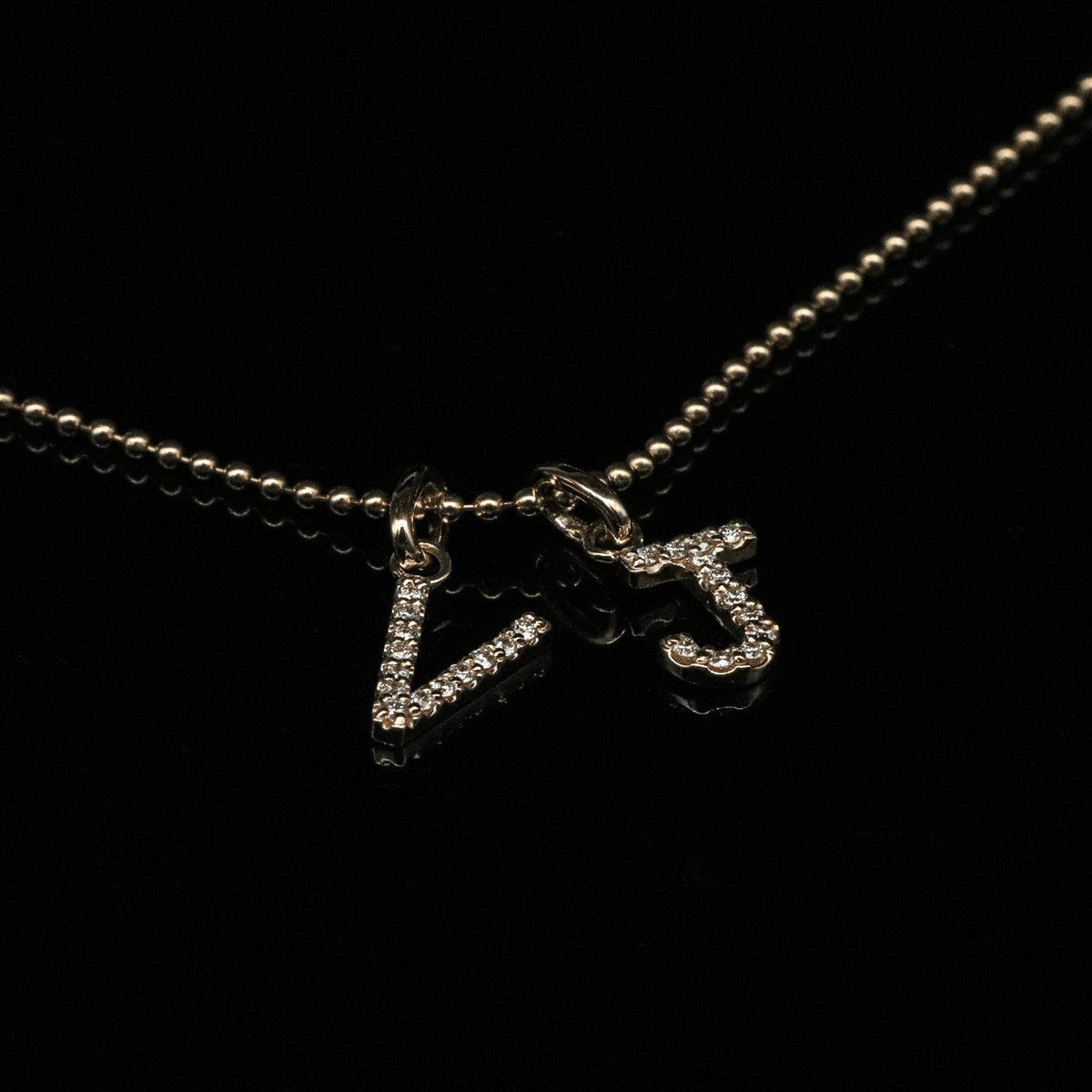 Diamond Letter Pendant in Yellow Gold Black Background