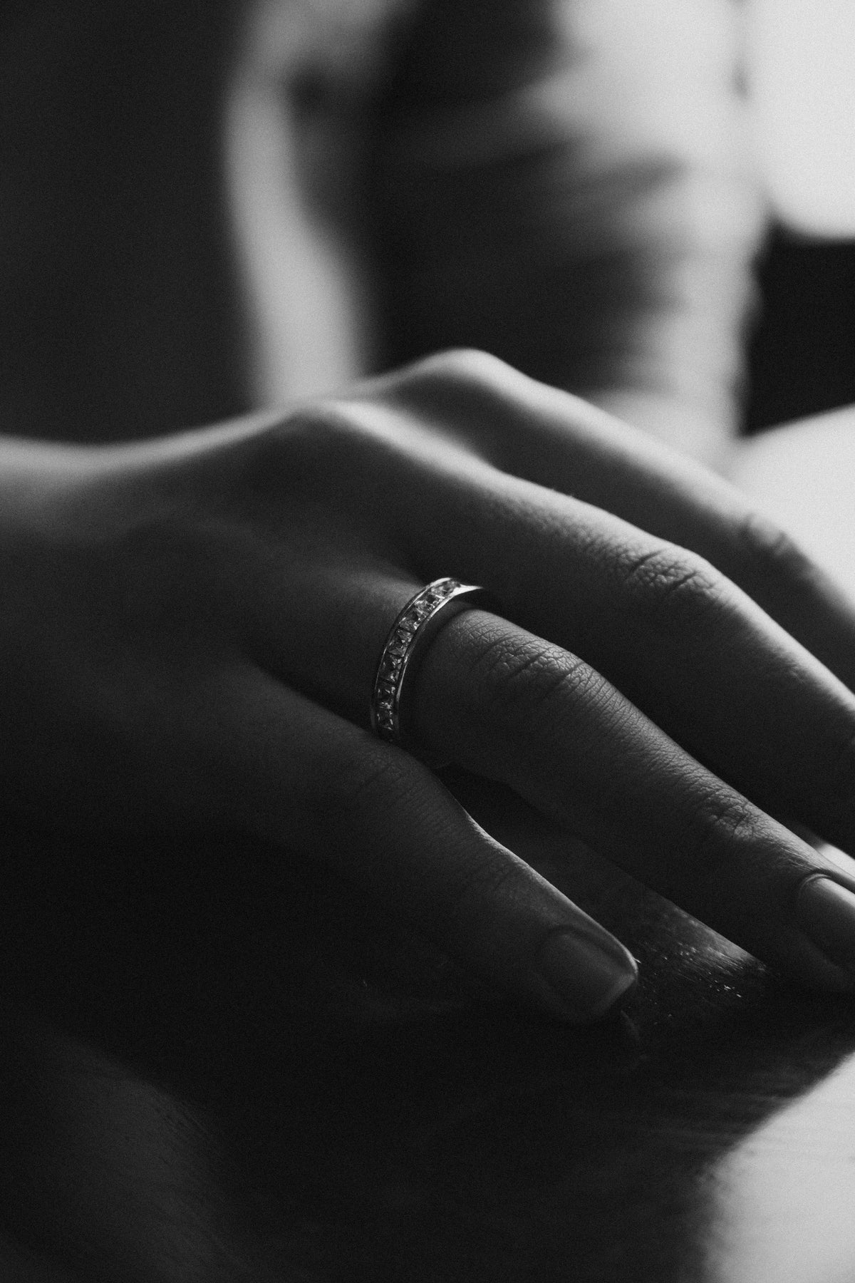 Eternity Ring on Hand - Black and White Photo