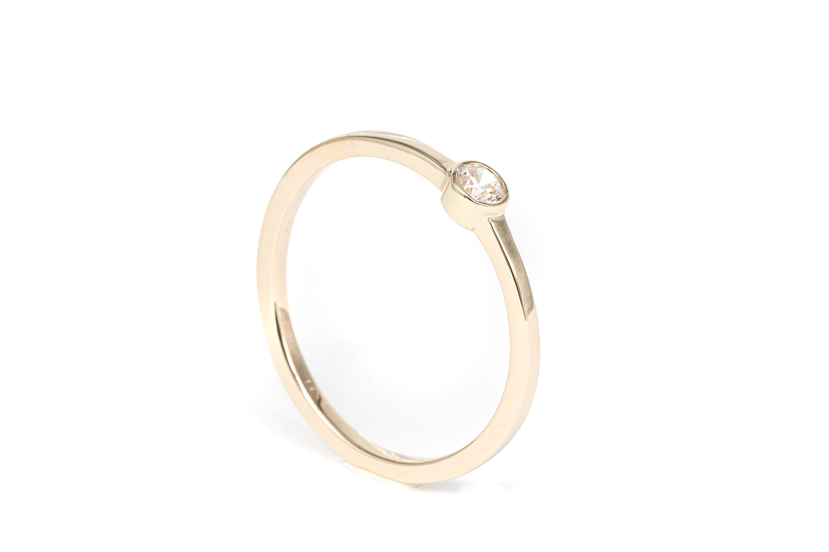 Moissanite Solitaire Ring in 14 Karat Yellow Gold (0.10 Carat)